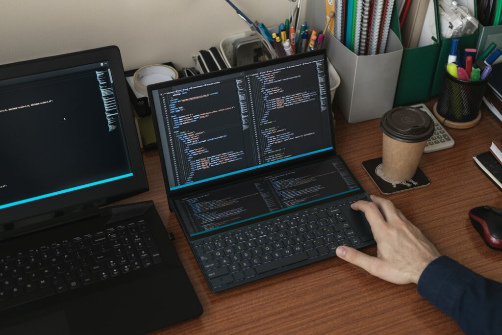 a person typing on a labtop