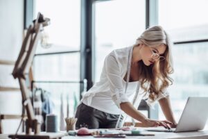 woman working at desk in front of labtop