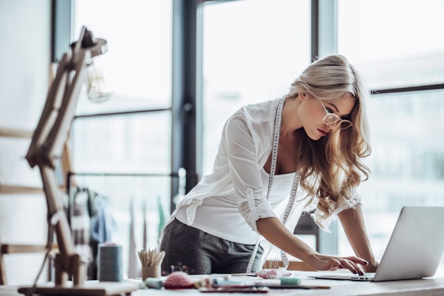 woman working at desk in front of labtop